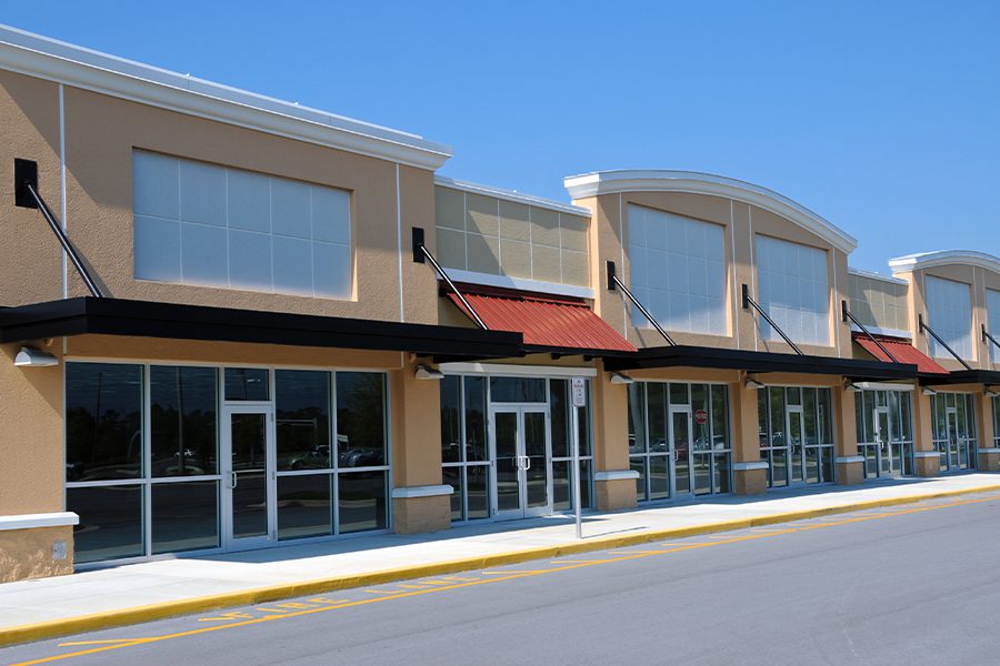 Vacant Building Insurance Vacant Retail Buildings in a New Shopping Center on a Sunny Day
