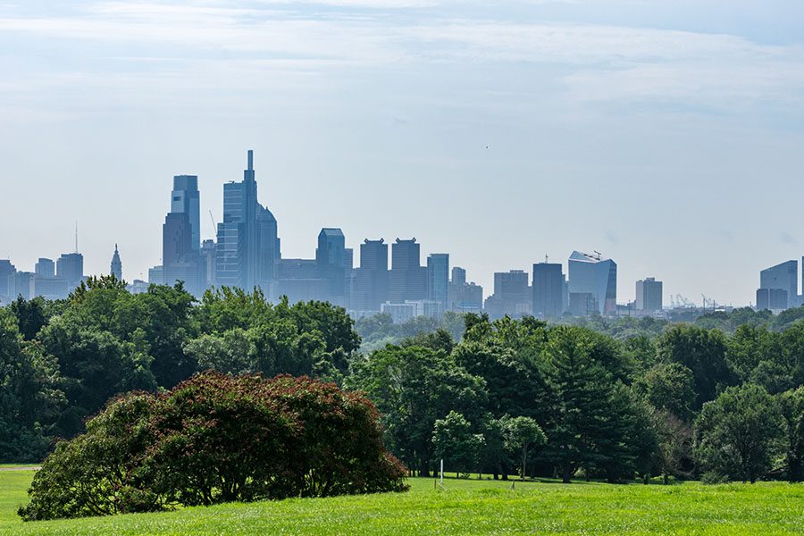 Hatboro PA Insurance - Beautiful Green Park With A Foogy Skyline View of Philadelphia